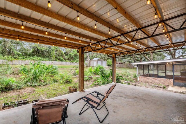 view of patio featuring a storage shed