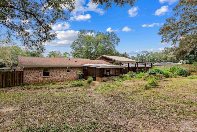 back of property featuring a sunroom