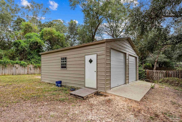 view of outdoor structure with a garage