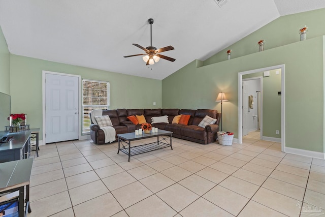 living room with light tile patterned floors, baseboards, vaulted ceiling, and a ceiling fan