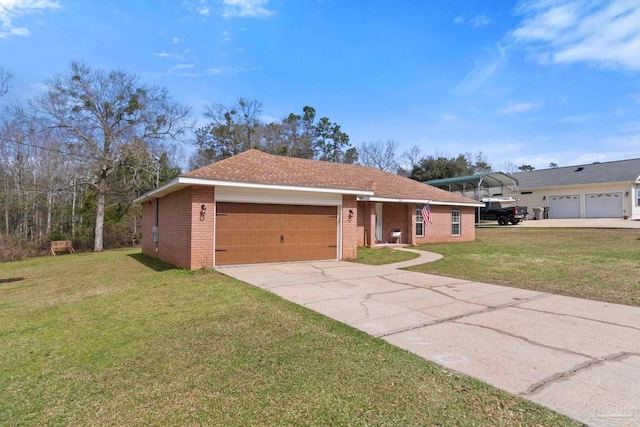 ranch-style house featuring a garage, driveway, brick siding, and a front lawn