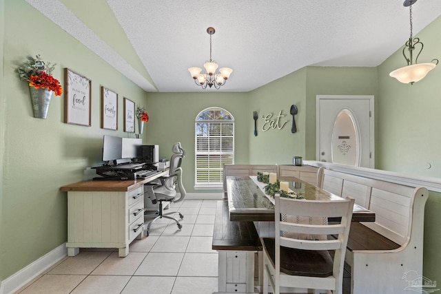 dining room featuring a notable chandelier, light tile patterned floors, lofted ceiling, a textured ceiling, and baseboards