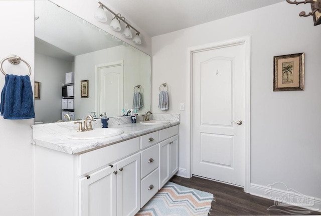 bathroom featuring vanity and hardwood / wood-style floors