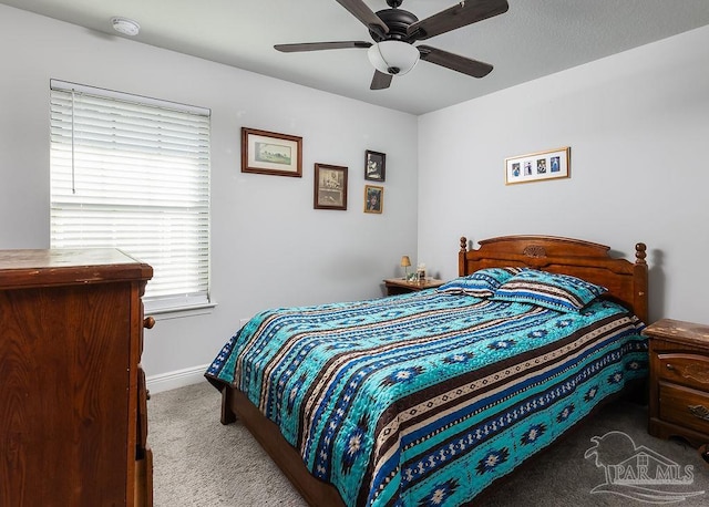 bedroom featuring ceiling fan and carpet floors