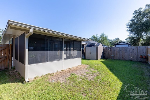 view of yard with a shed and a sunroom