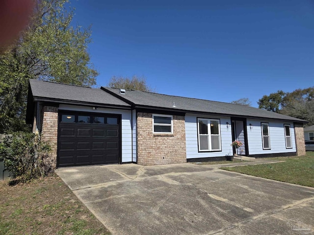 ranch-style house with brick siding, an attached garage, and concrete driveway