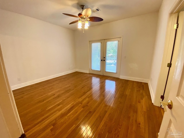 7208 Bayshore Dr, Milton, FL 32583 - unfurnished room with french doors, wood finished floors, a ceiling fan, and baseboards