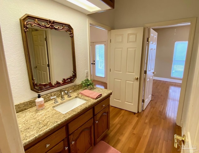 7208 Bayshore Dr, Milton, FL 32583 - bathroom featuring wood finished floors and vanity