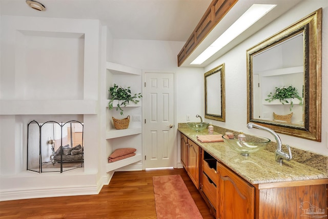 7208 Bayshore Dr, Milton, FL 32583 - full bath featuring double vanity and wood finished floors