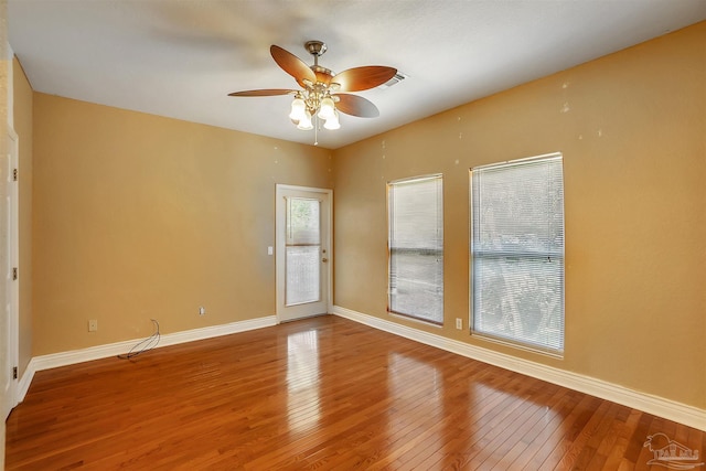 7208 Bayshore Dr, Milton, FL 32583 - spare room featuring hardwood / wood-style floors, ceiling fan, and baseboards
