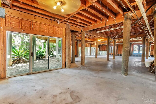 7208 Bayshore Dr, Milton, FL 32583 - miscellaneous room featuring unfinished concrete floors