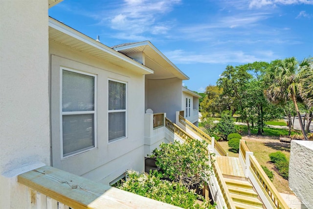 7208 Bayshore Dr, Milton, FL 32583 - view of property exterior with stairs and stucco siding