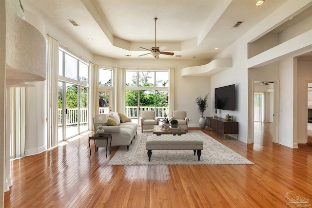 7208 Bayshore Dr, Milton, FL 32583 - living area featuring a ceiling fan, light wood finished floors, a raised ceiling, and recessed lighting