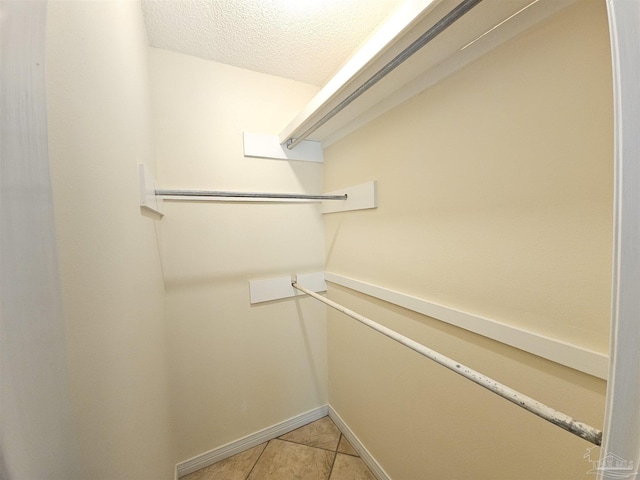 walk in closet featuring light tile patterned floors