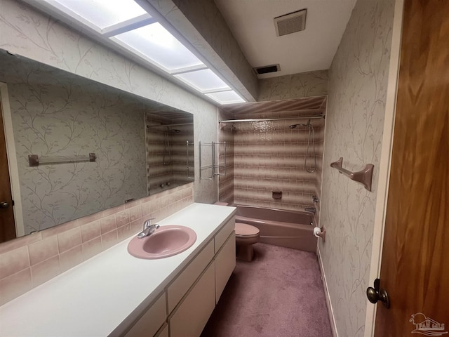 full bathroom featuring vanity, toilet, and shower / tub combination