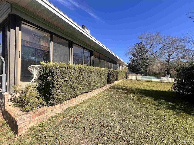 view of home's exterior with a yard