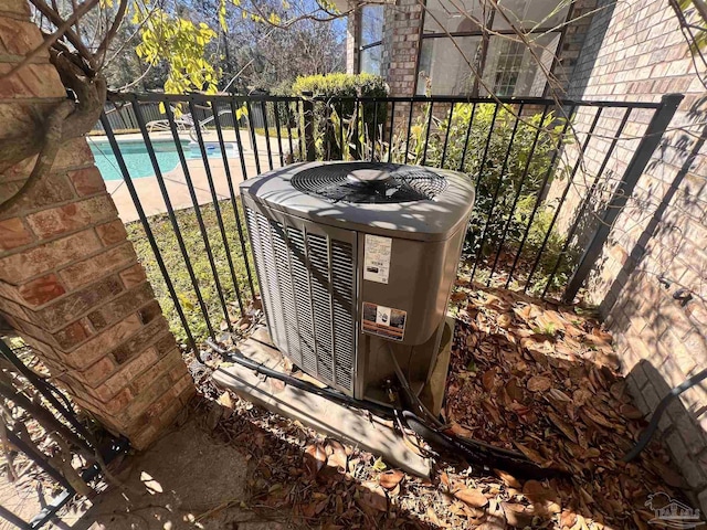 details featuring central AC unit and a pool