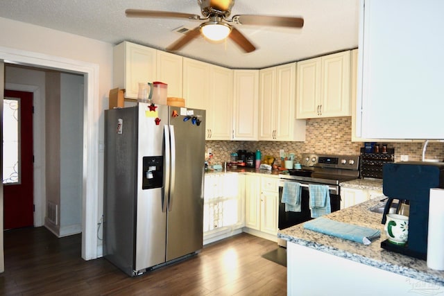 kitchen featuring light stone countertops, dark hardwood / wood-style flooring, stainless steel appliances, and white cabinetry