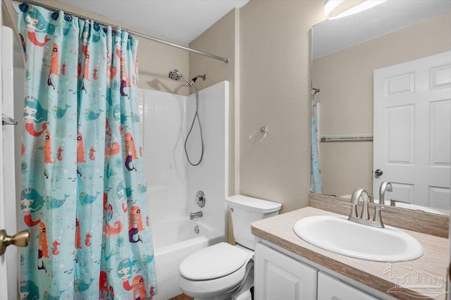 full bathroom with vanity, shower / bath combo, and toilet