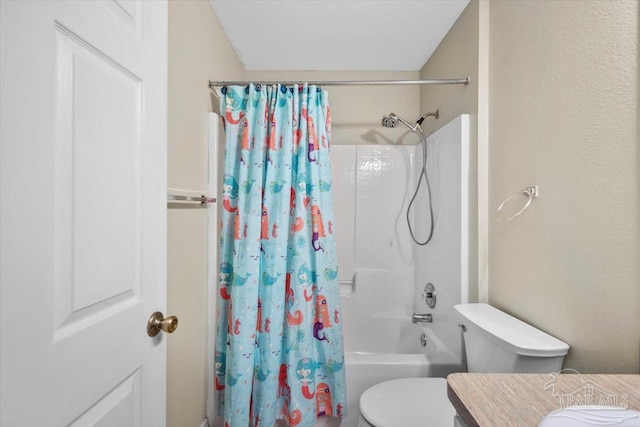 full bathroom with vanity, shower / bath combo, and toilet