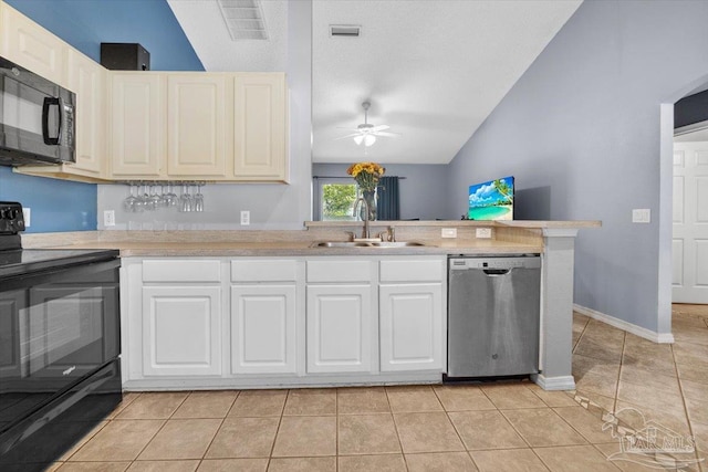 kitchen featuring lofted ceiling, black appliances, light tile patterned flooring, sink, and ceiling fan