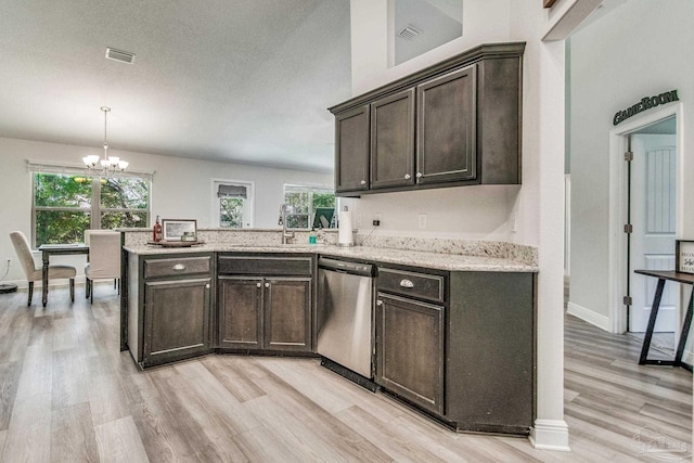 kitchen with dark brown cabinetry, dishwasher, sink, hanging light fixtures, and light wood-type flooring