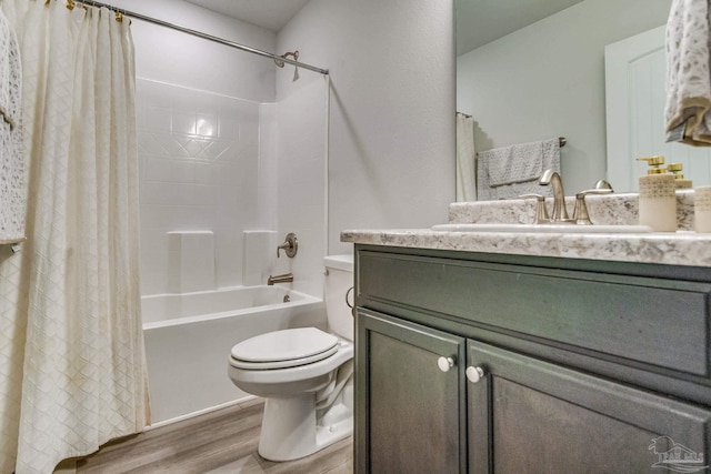 full bathroom with vanity, toilet, shower / bath combination with curtain, and hardwood / wood-style floors