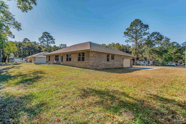 exterior space with a garage and a yard