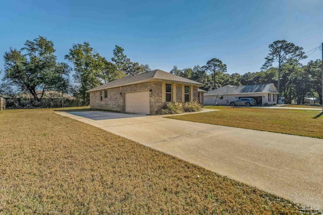 view of front of property with a front yard and a garage