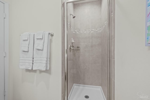 bathroom featuring a shower stall