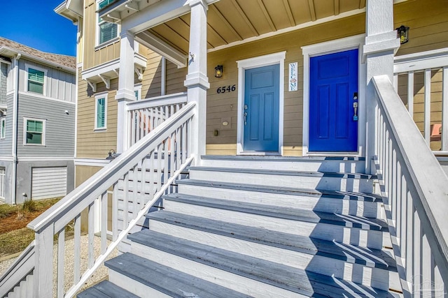 view of exterior entry featuring a porch