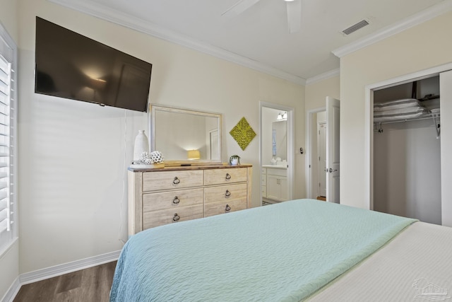 bedroom with baseboards, visible vents, ornamental molding, dark wood-style flooring, and a closet