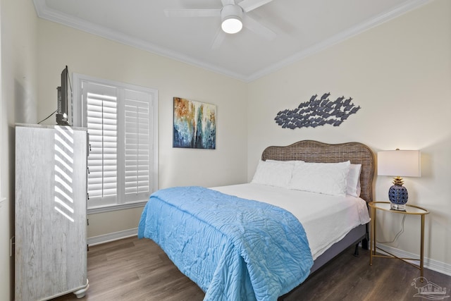 bedroom with ceiling fan, baseboards, crown molding, and wood finished floors