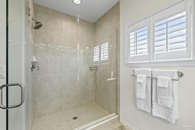 bathroom with a shower stall