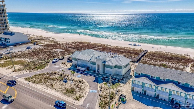 bird's eye view with a water view and a view of the beach