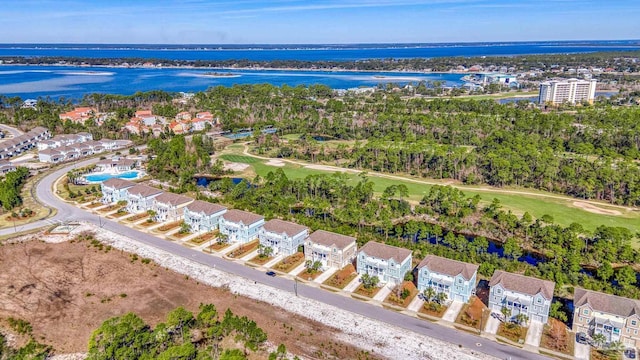 drone / aerial view with a water view and a residential view