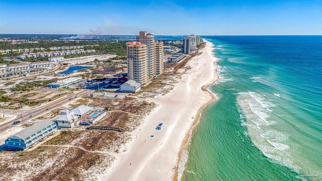 aerial view featuring a water view, a view of the beach, and a city view