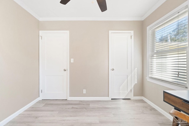 unfurnished bedroom featuring ceiling fan, crown molding, and light hardwood / wood-style flooring