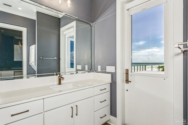 bathroom with vanity and a water view