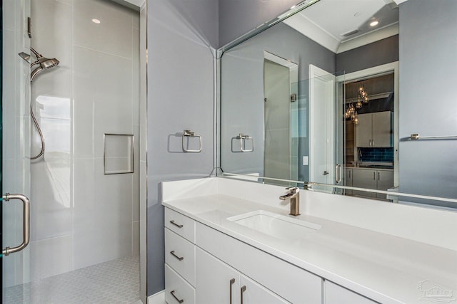 bathroom featuring vanity and an enclosed shower