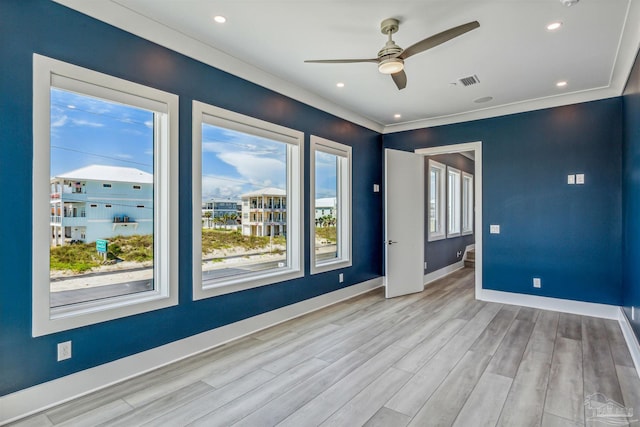 unfurnished room featuring ceiling fan and light wood-type flooring