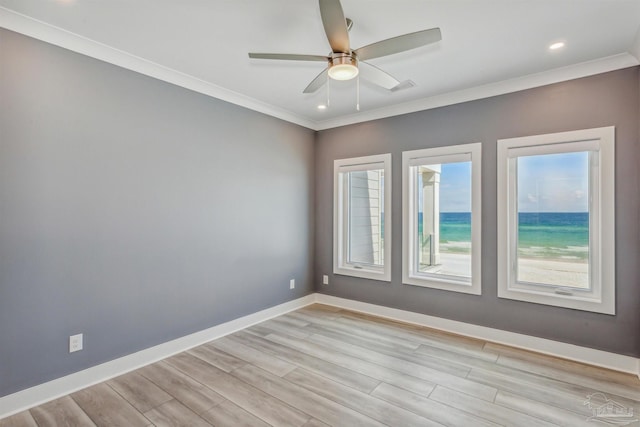 unfurnished room with crown molding, ceiling fan, and light hardwood / wood-style floors