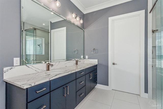 bathroom with tile patterned floors, an enclosed shower, and vanity