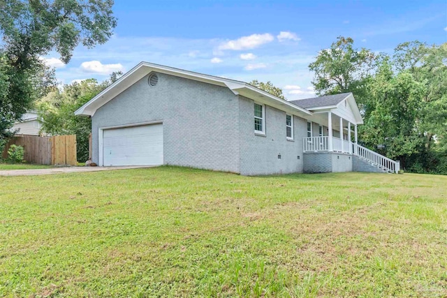 view of property exterior featuring a lawn and a garage