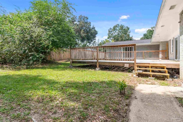 view of yard featuring a wooden deck