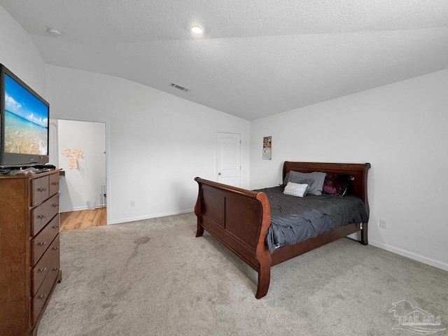 4695 Perception Cir, Milton, FL 32570 - bedroom with lofted ceiling, light colored carpet, baseboards, and a textured ceiling