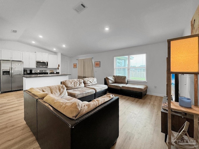 4695 Perception Cir, Milton, FL 32570 - living area featuring light wood-type flooring, lofted ceiling, and recessed lighting