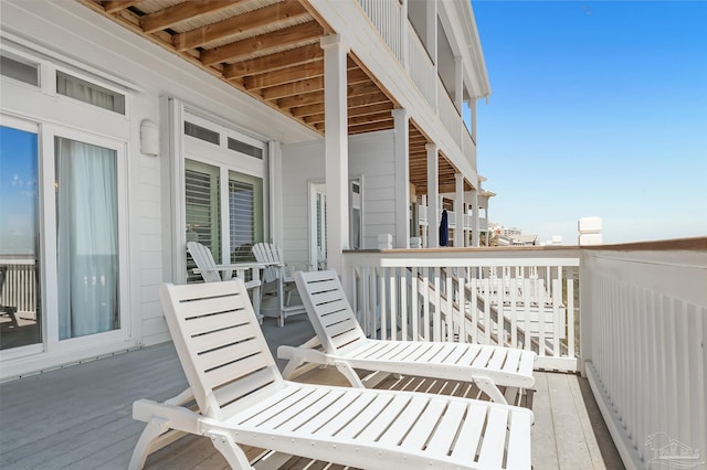 wooden balcony featuring a deck