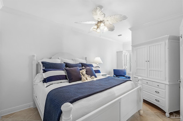 bedroom featuring light tile patterned floors, ornamental molding, and ceiling fan