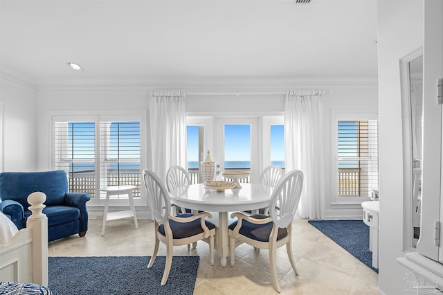 tiled dining area with crown molding